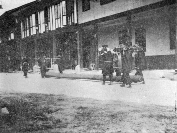 CHINESE WOMEN CARRYING LOG, SANDAKAN.