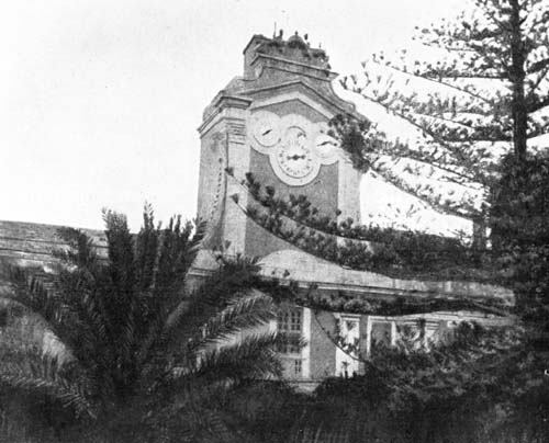 THE CLOCK ABOVE THE ANCIENT CHURCH HAS A TRIPLE FACE.