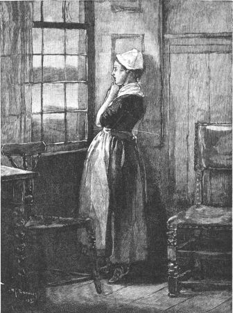 woman looking out window