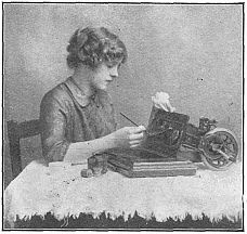 woman at table cleaning machine