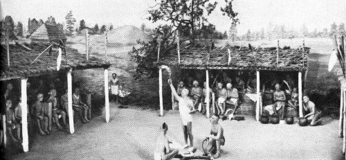 The “husk” or green corn ceremony, still practiced today, may be as old as the Indian’s use of corn. Here the priest offers the new fire to the Master of Breath. Museum diorama.