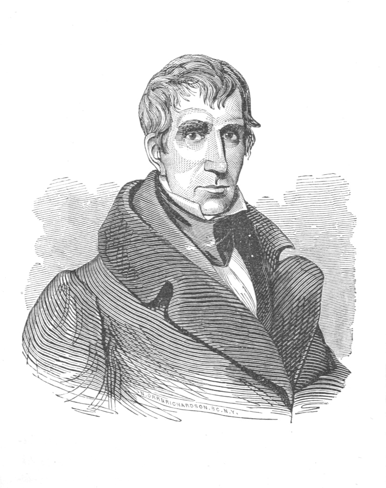Portrait, wearing a heavy coat and ascot, head and uppoer torso.